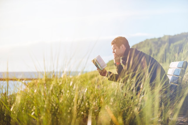 a-man-reading-books